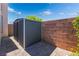 This backyard features a storage shed, block wall, pavers, and low maintenance landscaping at 420 Aloha Dr, Henderson, NV 89015