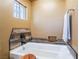 Elegant bathroom showcasing a soaking tub with wood-style accents and a convenient towel rack at 420 Aloha Dr, Henderson, NV 89015