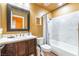 This is a stylish bathroom with a modern vanity, large mirror, and tub-shower combination with a decorative shower curtain at 420 Aloha Dr, Henderson, NV 89015