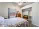 Bedroom with natural light, a ceiling fan, carpeted floor, and access to a closet at 420 Aloha Dr, Henderson, NV 89015