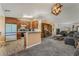 Open-concept floorplan showing the kitchen, living room and dining nook at 420 Aloha Dr, Henderson, NV 89015