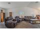 Spacious living room features carpeting and an abundance of seating for entertaining at 420 Aloha Dr, Henderson, NV 89015