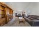 Living room featuring a media center, multiple seating options, and a neutral color palette at 420 Aloha Dr, Henderson, NV 89015