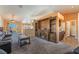 Open-concept living room with a large built-in entertainment center, and a back patio at 420 Aloha Dr, Henderson, NV 89015