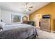 Spacious main bedroom with vaulted ceiling, and ensuite bathroom at 420 Aloha Dr, Henderson, NV 89015