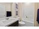 Well-lit bathroom features a single sink vanity and a shower-tub combo with white tiling at 4350 E Brusca Way, Pahrump, NV 89061
