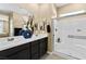 Modern bathroom featuring double vanity sinks, a glass-enclosed shower, and neutral paint at 4350 E Brusca Way, Pahrump, NV 89061