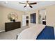 A primary bedroom with carpeted floors, neutral walls, and a view of the bathroom and closet at 4350 E Brusca Way, Pahrump, NV 89061