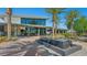 Modern water feature surrounded by palm trees with large windows and manicured landscaping at 4350 E Brusca Way, Pahrump, NV 89061