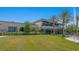 Well-manicured lawn and lush landscaping surround this contemporary building with large windows at 4350 E Brusca Way, Pahrump, NV 89061