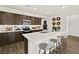 Beautiful kitchen with a large center island, modern appliances, and stylish dark cabinets at 4350 E Brusca Way, Pahrump, NV 89061