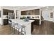 A kitchen featuring a spacious island, stainless steel appliances, and dark wood cabinets at 4350 E Brusca Way, Pahrump, NV 89061