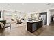 A bright open-concept living space with hardwood floors, and a center island with bar seating at 4350 E Brusca Way, Pahrump, NV 89061