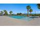 Community pool has sun loungers and lush greenery surrounding the pool area at 4350 E Brusca Way, Pahrump, NV 89061