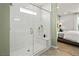 Modern glass enclosed shower with tiled walls and a view into the main bedroom at 4365 E Brusca Way, Pahrump, NV 89061
