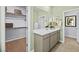 Elegant bathroom featuring double sinks, a large mirror, and an adjacent walk-in closet at 4365 E Brusca Way, Pahrump, NV 89061