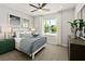 Well-appointed bedroom with a ceiling fan, plush carpet, and neutral walls at 4365 E Brusca Way, Pahrump, NV 89061