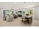 Bright, open living room featuring tile floors, neutral decor, and seamless indoor/outdoor living at 4365 E Brusca Way, Pahrump, NV 89061