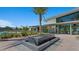 Striking water feature enhances outdoor space, complemented by modern architecture and beautifully manicured landscaping at 4365 E Brusca Way, Pahrump, NV 89061