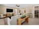 Cozy living room with stylish decor and a view of the kitchen and front entry at 4365 E Murlo Rd, Pahrump, NV 89061