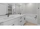 Bright bathroom with double vanity, soaking tub, and sleek, modern fixtures at 4412 Cave Lake Ave, North Las Vegas, NV 89032