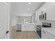 Modern kitchen with white cabinets, stainless steel appliances, and quartz countertops at 4412 Cave Lake Ave, North Las Vegas, NV 89032