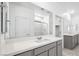 Bathroom featuring double sink vanity with gray cabinets and a large mirror at 4450 E Brusca Ct, Pahrump, NV 89061