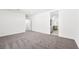 Spacious bedroom featuring plush gray carpeting and a walk-in closet at 4450 E Brusca Ct, Pahrump, NV 89061