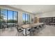 Conference room featuring a long table, multiple chairs, and a wall-lined bookshelf at 4450 E Brusca Ct, Pahrump, NV 89061