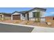 Attractive one-story home features desert landscaping and a brick paved driveway at 4450 E Brusca Ct, Pahrump, NV 89061