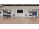 Spacious gym area with workout equipment, medicine balls, and a large wall-mounted television at 4450 E Brusca Ct, Pahrump, NV 89061