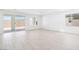 Spacious living room boasts tile flooring and sliding door access to the backyard at 4450 E Brusca Ct, Pahrump, NV 89061