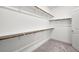 Walk-in closet with carpet and open shelving for efficient organization at 4450 E Brusca Ct, Pahrump, NV 89061