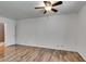 Spacious bedroom with wood-look floors and ceiling fan, offering a comfortable and inviting atmosphere at 5240 Indian River Dr # 273, Las Vegas, NV 89103