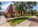 View of building with mature trees, bushes, well manicured lawn and sidewalks at 5240 Indian River Dr # 273, Las Vegas, NV 89103