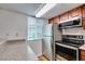 Well-lit kitchen features stainless steel appliances and granite countertops at 5240 Indian River Dr # 273, Las Vegas, NV 89103