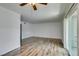 Open living room with modern wood flooring, leading to a balcony and providing ample space at 5240 Indian River Dr # 273, Las Vegas, NV 89103