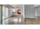 Comfortable living room with new wood flooring, leading to sliding doors and an open kitchen space at 5240 Indian River Dr # 273, Las Vegas, NV 89103