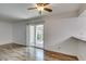 Bright living room with wood floors and access to a balcony and breakfast bar at 5240 Indian River Dr # 273, Las Vegas, NV 89103