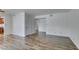 Bright living room featuring modern wood flooring and access to other rooms at 5240 Indian River Dr # 273, Las Vegas, NV 89103