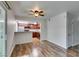 Spacious living room with modern wood flooring and views into the updated kitchen at 5240 Indian River Dr # 273, Las Vegas, NV 89103