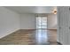 Spacious living area featuring wood floors and a sliding glass door to balcony at 5240 Indian River Dr # 273, Las Vegas, NV 89103