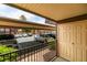 View of patio leading to covered parking with beige doors at 5240 Indian River Dr # 273, Las Vegas, NV 89103