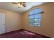 Bedroom with large window offering natural light, creating a warm and inviting ambiance at 6242 Halehaven Dr, Las Vegas, NV 89110