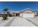 Charming single-story home with a well-maintained yard and an attached two-car garage at 6242 Halehaven Dr, Las Vegas, NV 89110