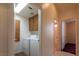 Hallway featuring laundry room with washer and dryer at 6242 Halehaven Dr, Las Vegas, NV 89110