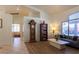 Open living area boasting tile and wood-look floors, large windows, and neutral decor at 6242 Halehaven Dr, Las Vegas, NV 89110