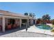 Backyard pool with seating area, perfect for entertaining and enjoying the outdoors at 6242 Halehaven Dr, Las Vegas, NV 89110