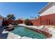 Backyard pool with stone accents, providing a refreshing oasis for relaxation and enjoyment at 6242 Halehaven Dr, Las Vegas, NV 89110