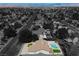 Expansive aerial view of a home showcasing a private pool and desert landscaping at 6330 Spring Meadow Dr, Las Vegas, NV 89103